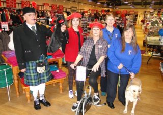 Piper Mike Harper; Edinburgh Woollen Mill staff Ebony Bedler and Dawn Irwin; and Shirley Reed, Michaela Mallows and Tessie your dog from Guide puppies for the Blind. Picture: Sarah Howells